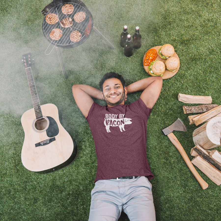 Body by Bacon T-Shirt on Man Laying in Grass at a BBQ