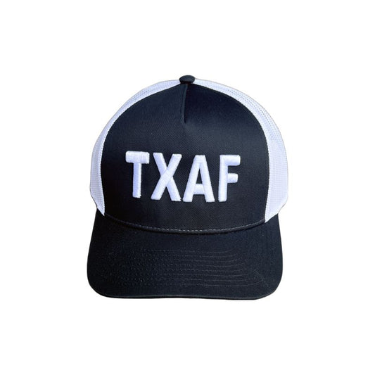TXAF Trucker Hat in black and white with bold Texas embroidery.